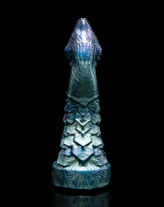 Adder the basilisk, a snake inspired dildo with a clitoral stimulator. This is a detailed photo of the scale texture down the backside of the dildo.